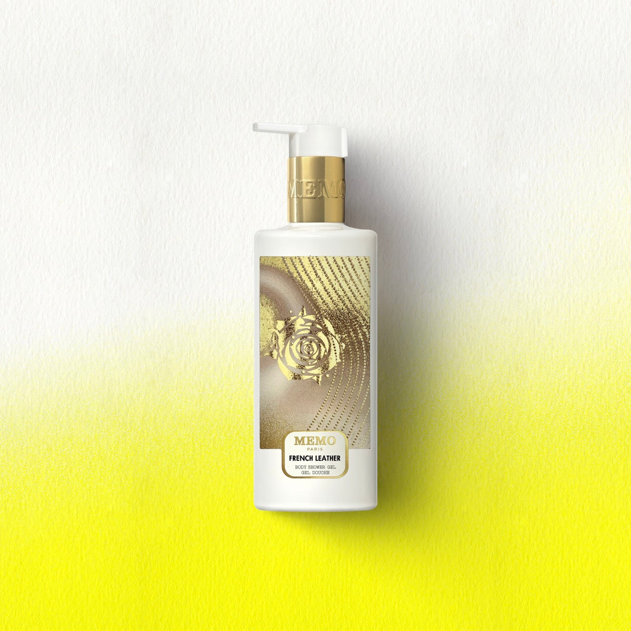 White bottle of memo paris french leather shower gel with gold pump and rose label for beauty routine use