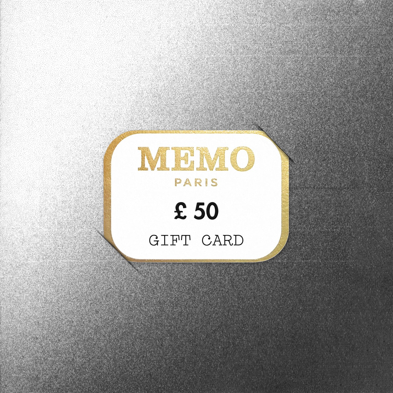 A white and gold memo paris gift card with elegant typography and a 50 dollar value celebrating dream destinations