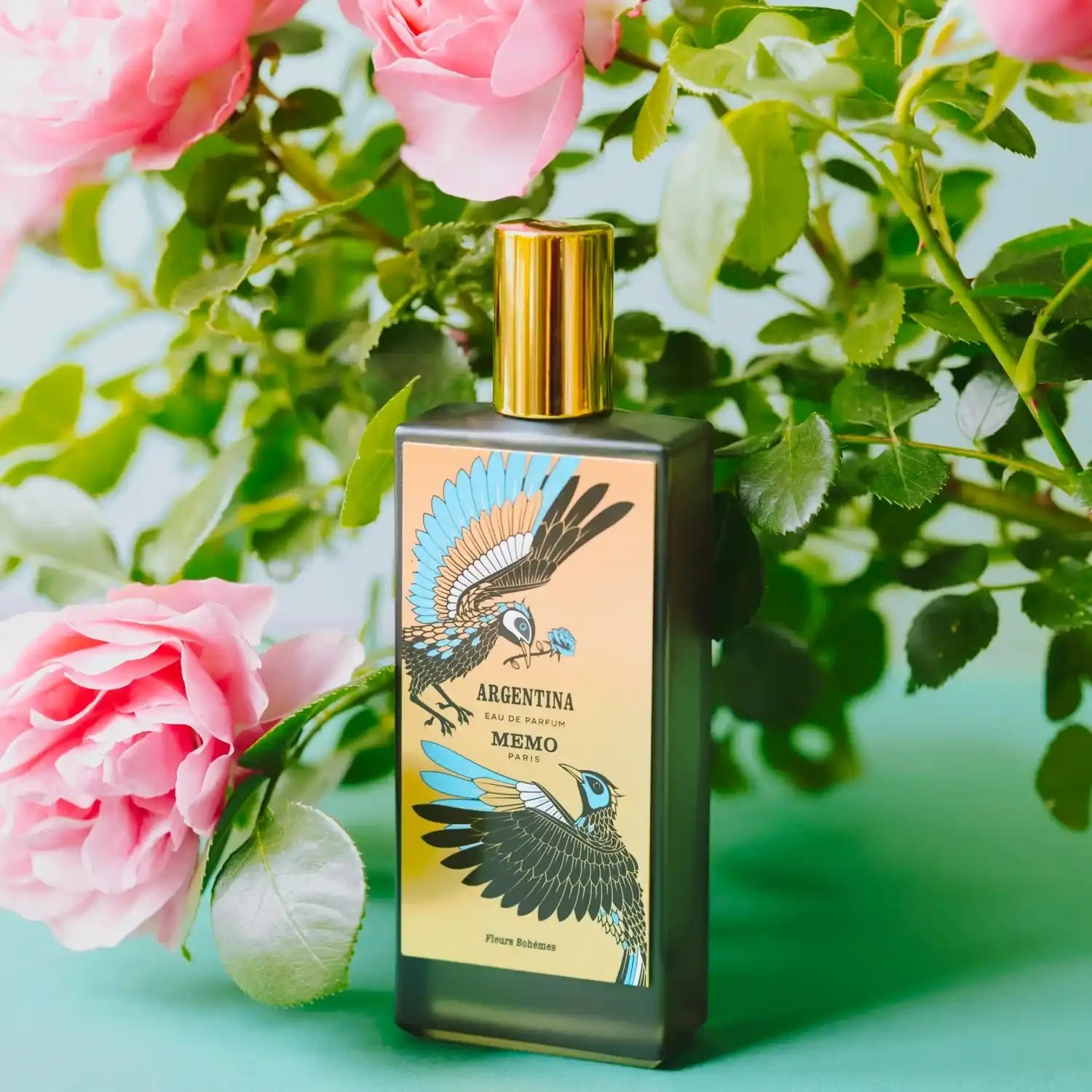Perfume bottle with bird illustrations.