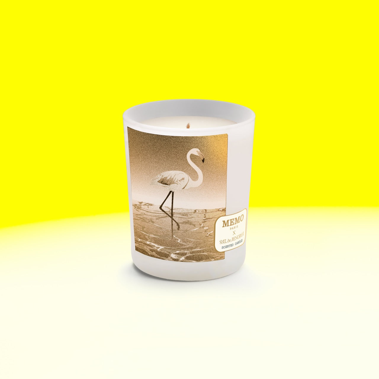 White frosted glass candle jar with gold foil flamingo and memo paris label for sal de menorca scent