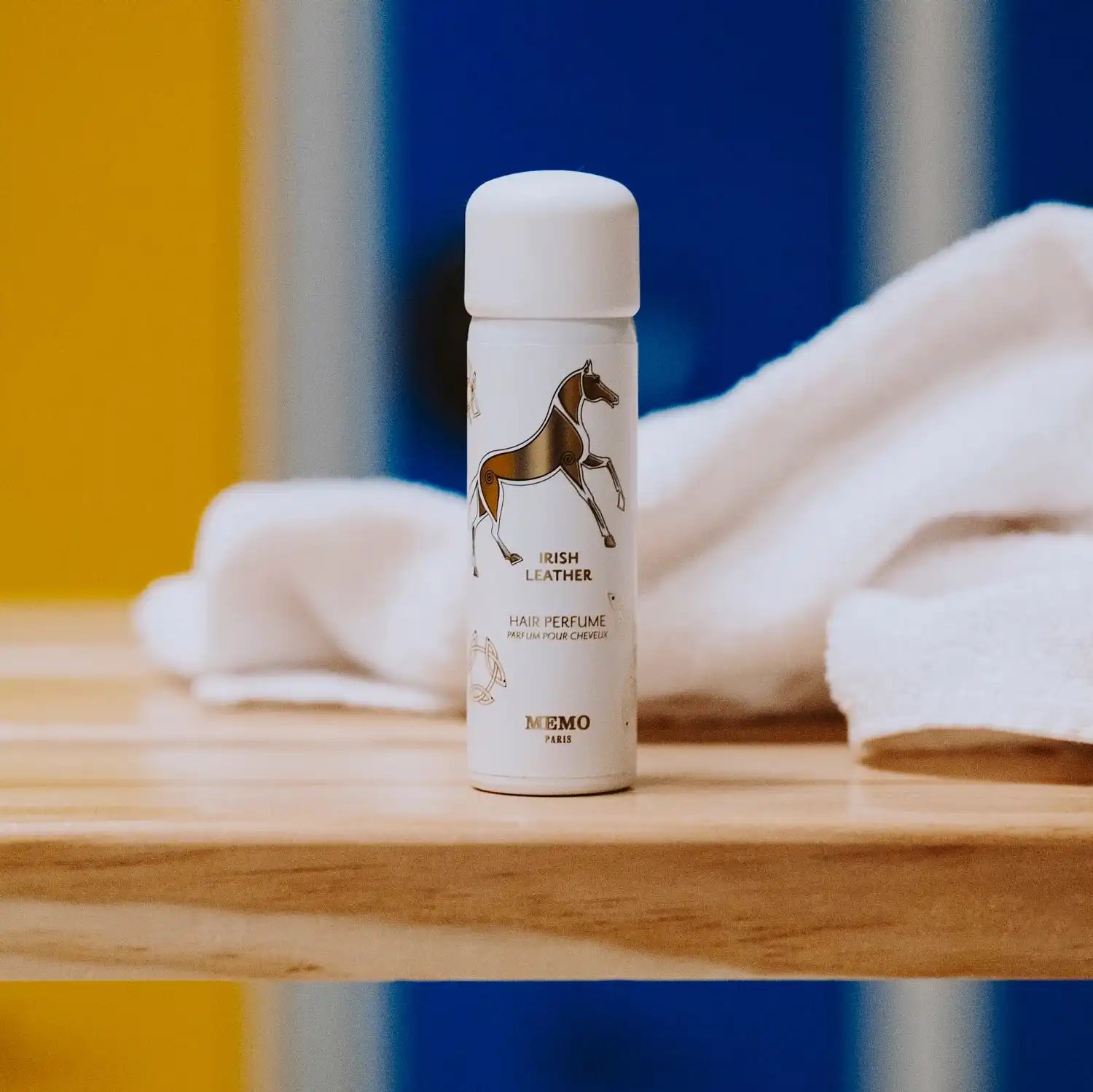 White perfume bottle with horse design.
